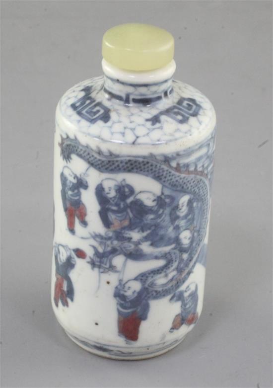 A Chinese underglaze blue and copper red cylindrical snuff bottle, 19th century, height 7.3cm excl. stopper